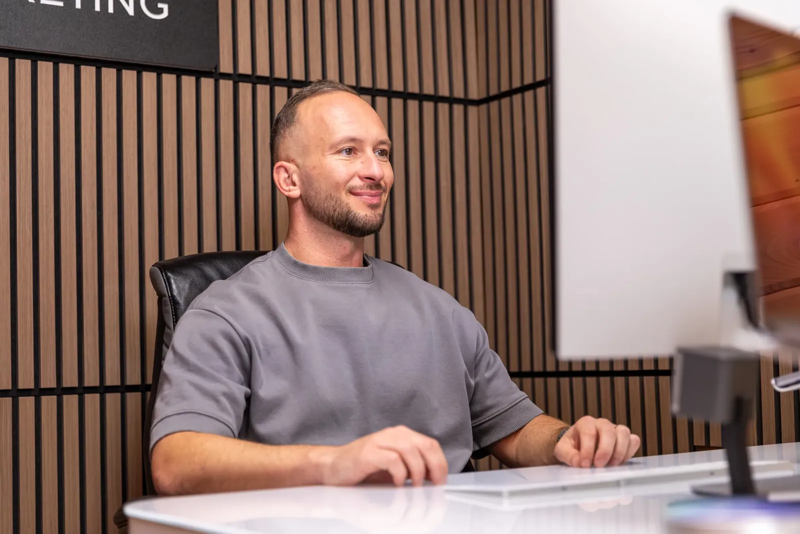 Maciej (Matt) Konarzewski designing a Wix website at his desk