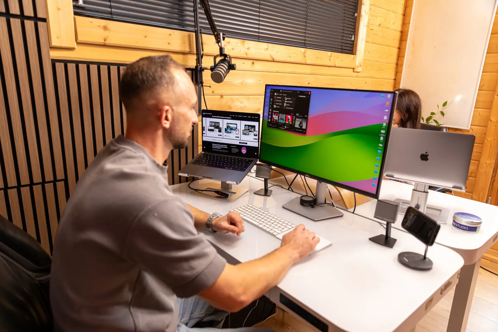 Maciej (Matt) Konarzewski working in Wix Studio at his desk
